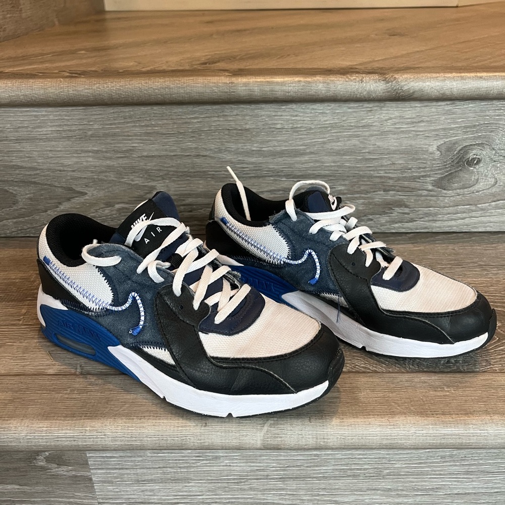 Youth Nike Air Black and White Sneakers with Blue Accents